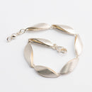 Lumoava rannekoru • Caratia