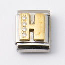 Nomination H-kirjain kivillä • Caratia