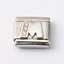 Nomination M-kirjain kivillä • Caratia