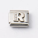 Nomination R-kirjain kivillä • Caratia