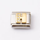 Nomination H-kirjain kivillä • Caratia