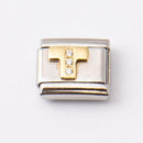 Nomination T-kirjain kivillä • Caratia