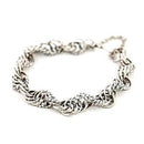 Kalevala Koru setukaisten rannekoru hopeoitu • Caratia